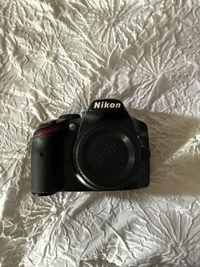 Nikon Black DSLR Camera Body with Subtle Red Accent